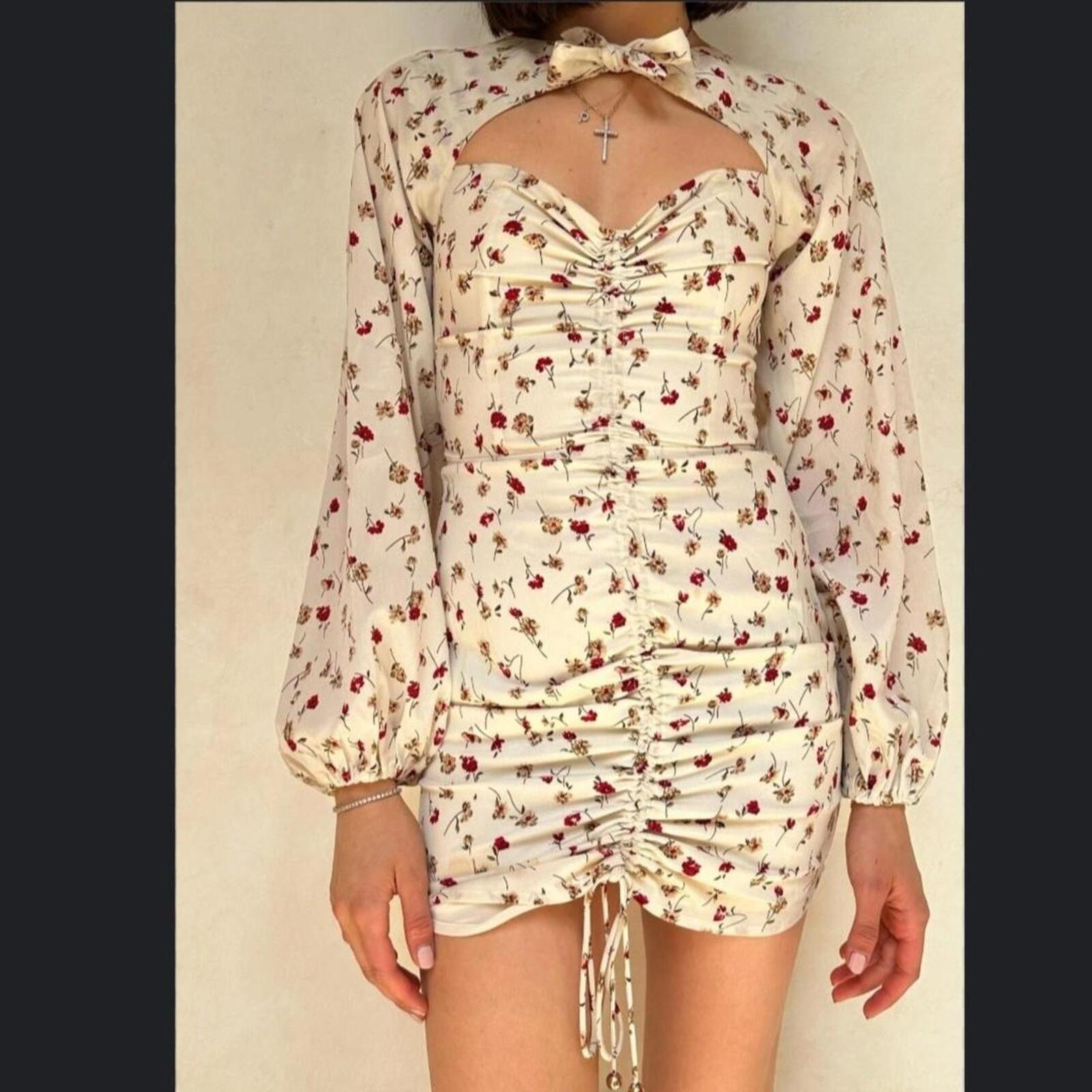Sabo Skirt Cream and pink floral mini dress with a ruched front and tie up detail