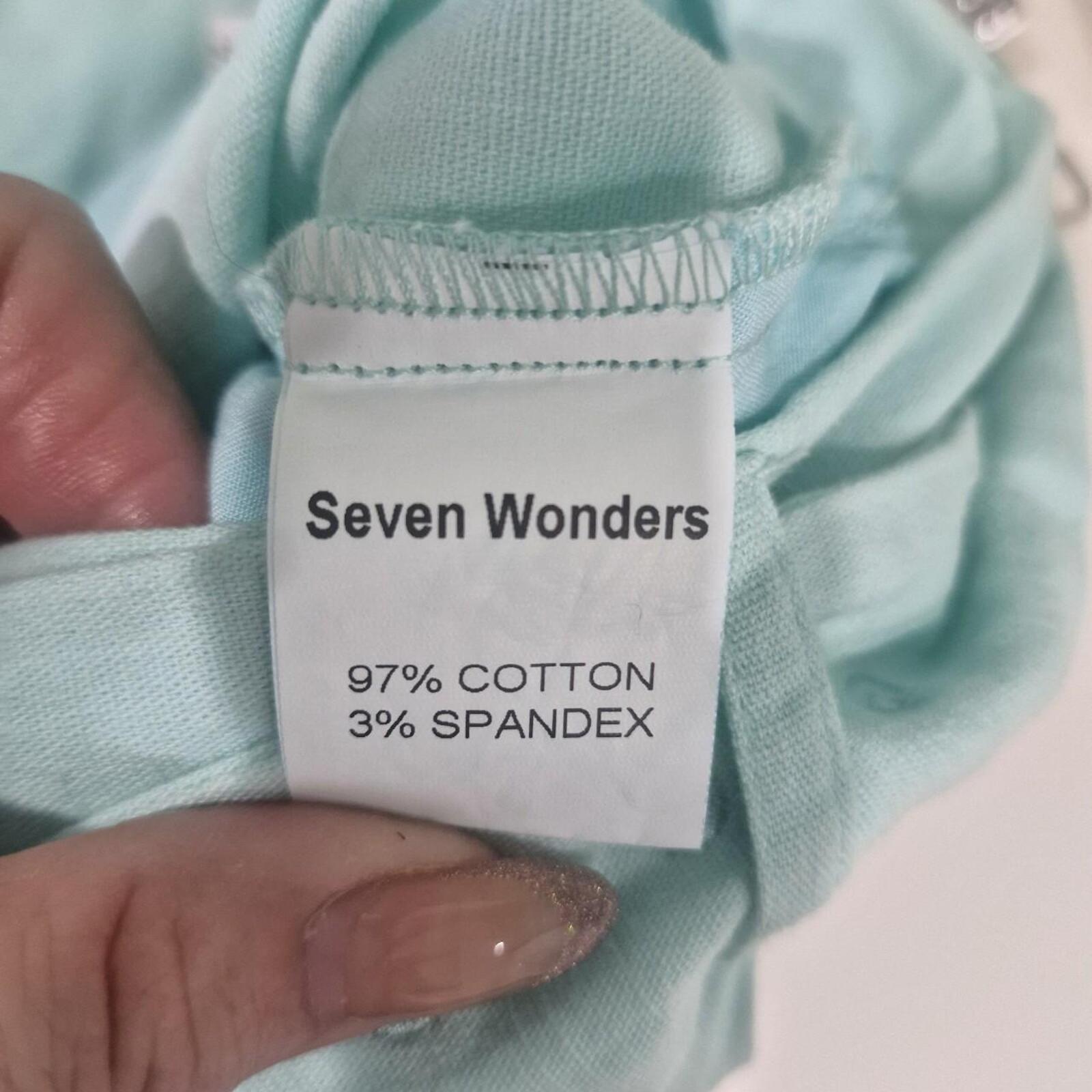 Seven Wonders mint green capri trousers with belt.