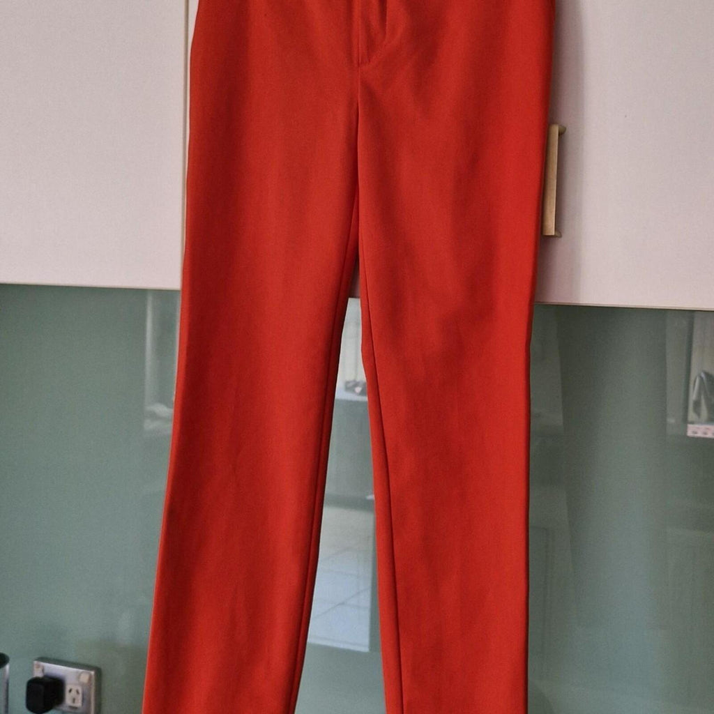 Zara orange high-waisted trousers