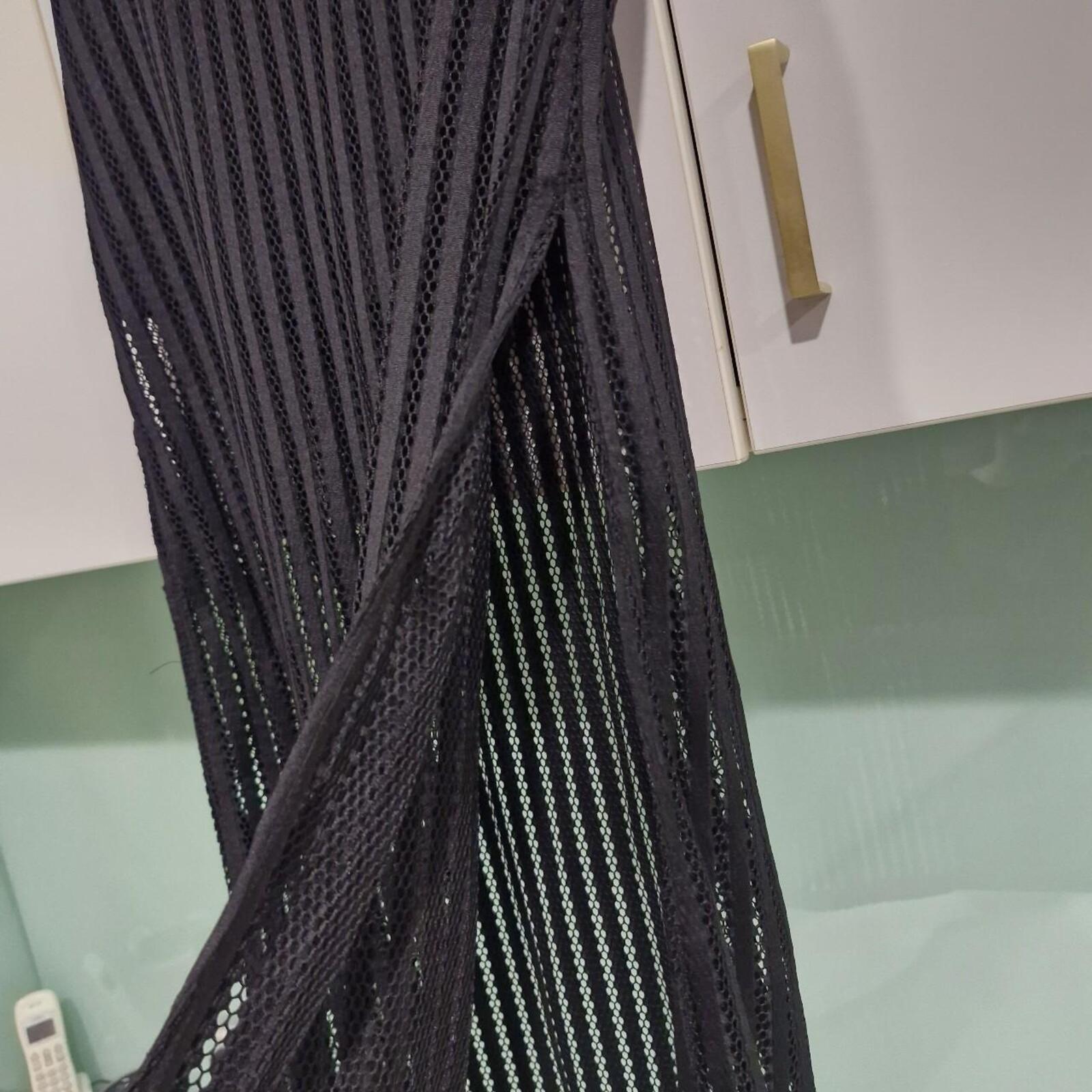 Black maxi skirt with side slit and mesh overlay
