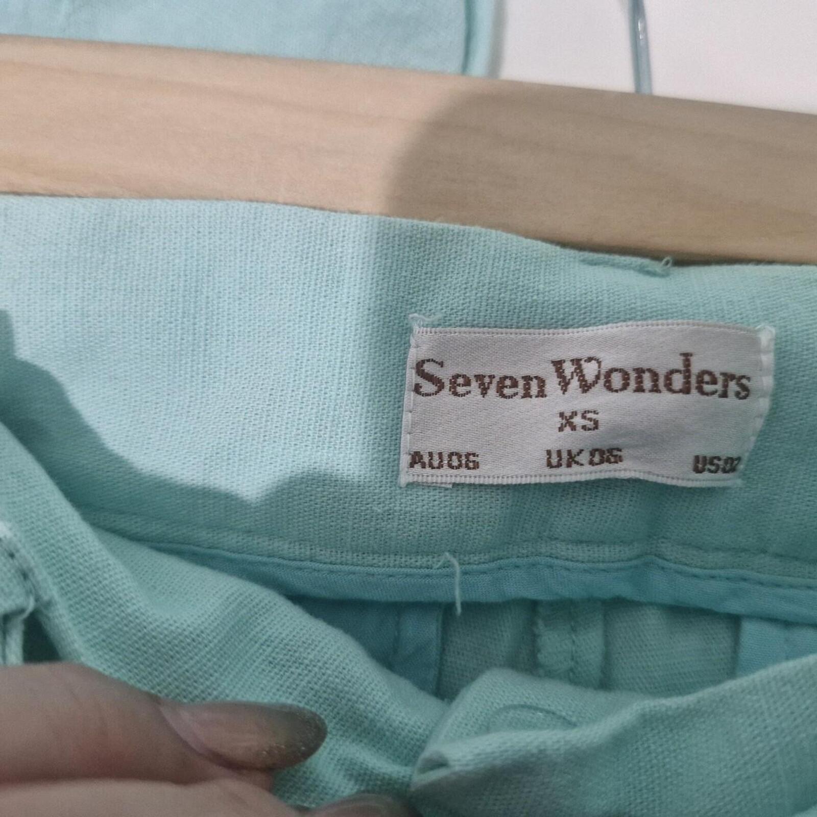 Seven Wonders mint green capri trousers with belt.