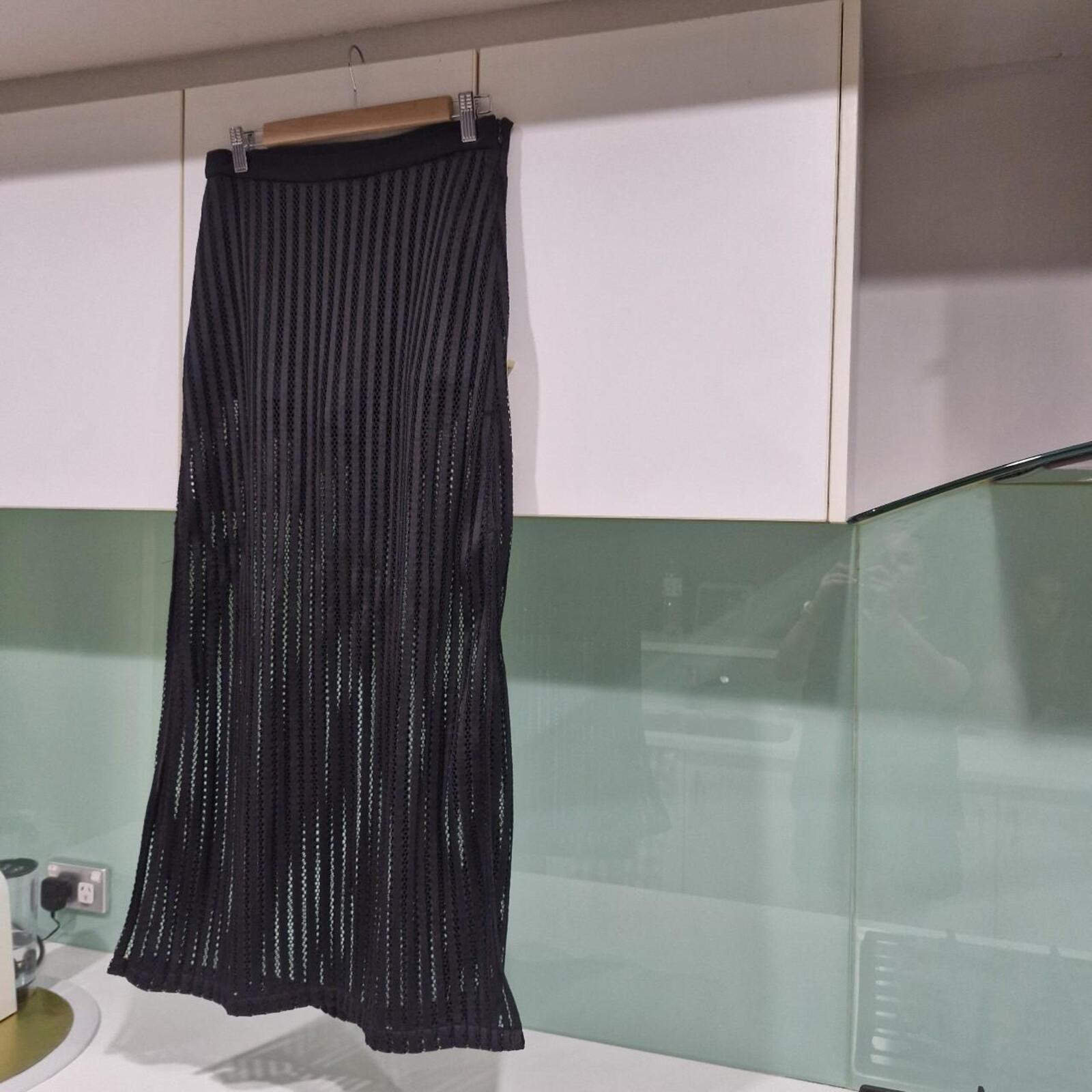 Black maxi skirt with side slit and mesh overlay