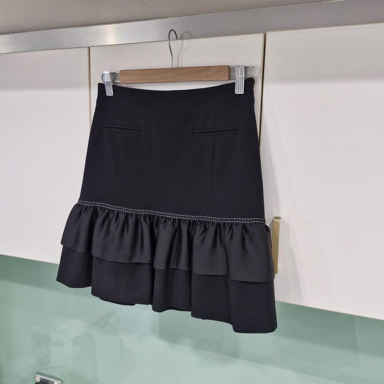 REVIEW Black mini skirt with ruffle hem and white stitching