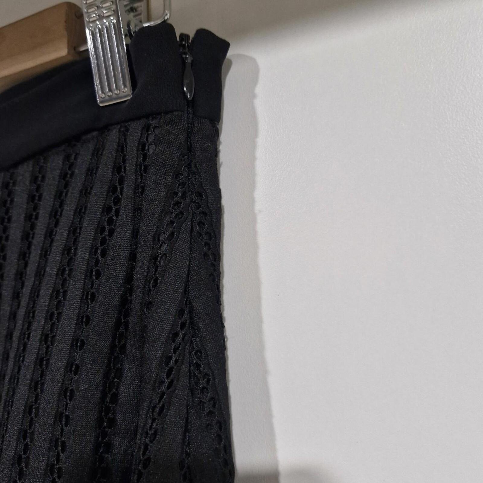 Black maxi skirt with side slit and mesh overlay