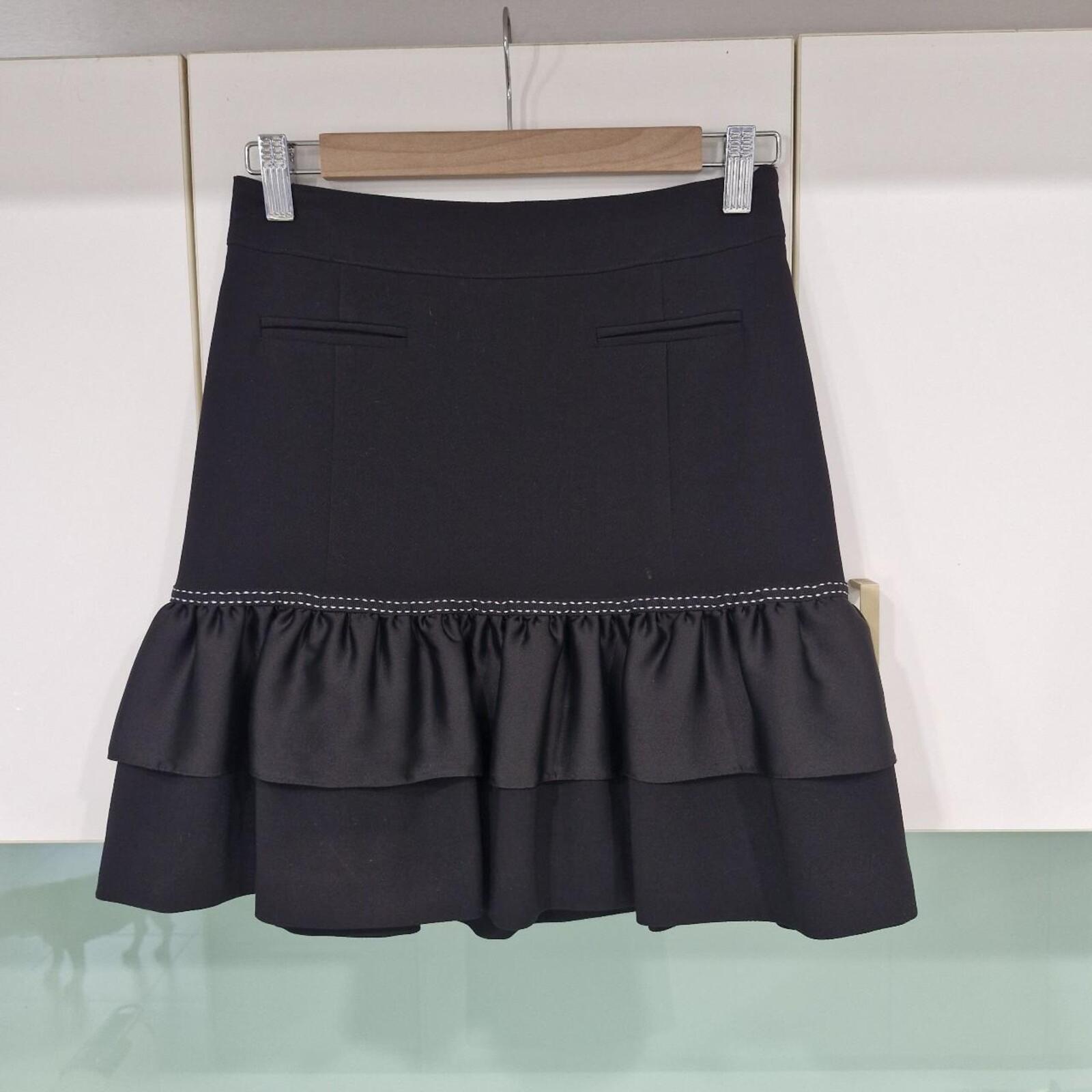 REVIEW Black mini skirt with ruffle hem and white stitching