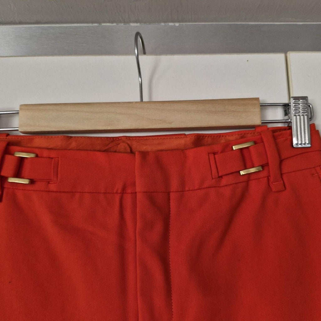 Zara orange high-waisted trousers