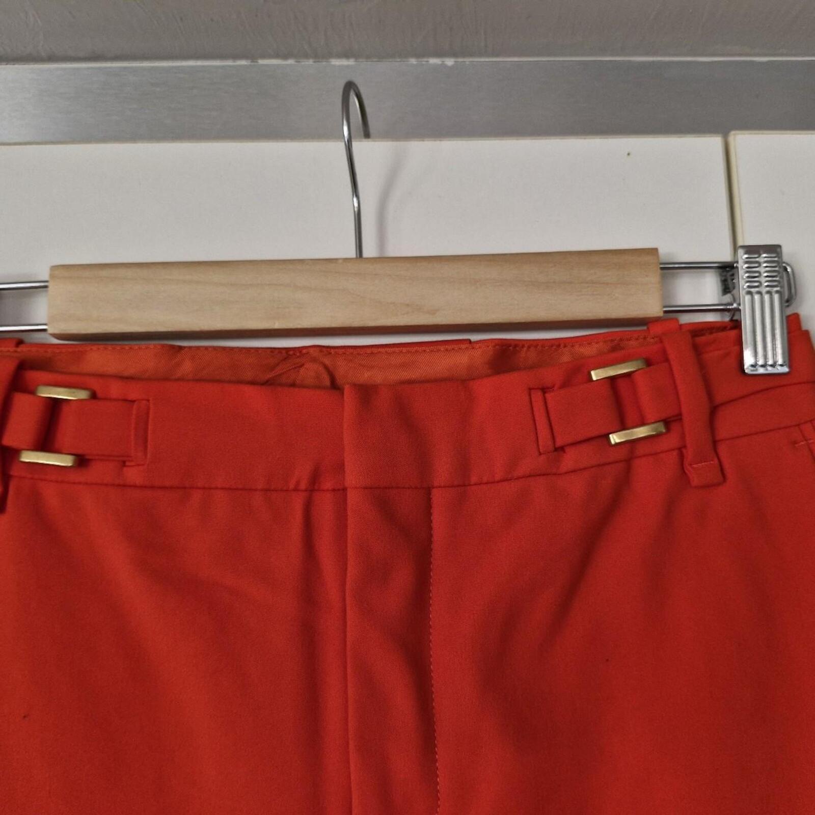 Zara orange high-waisted trousers