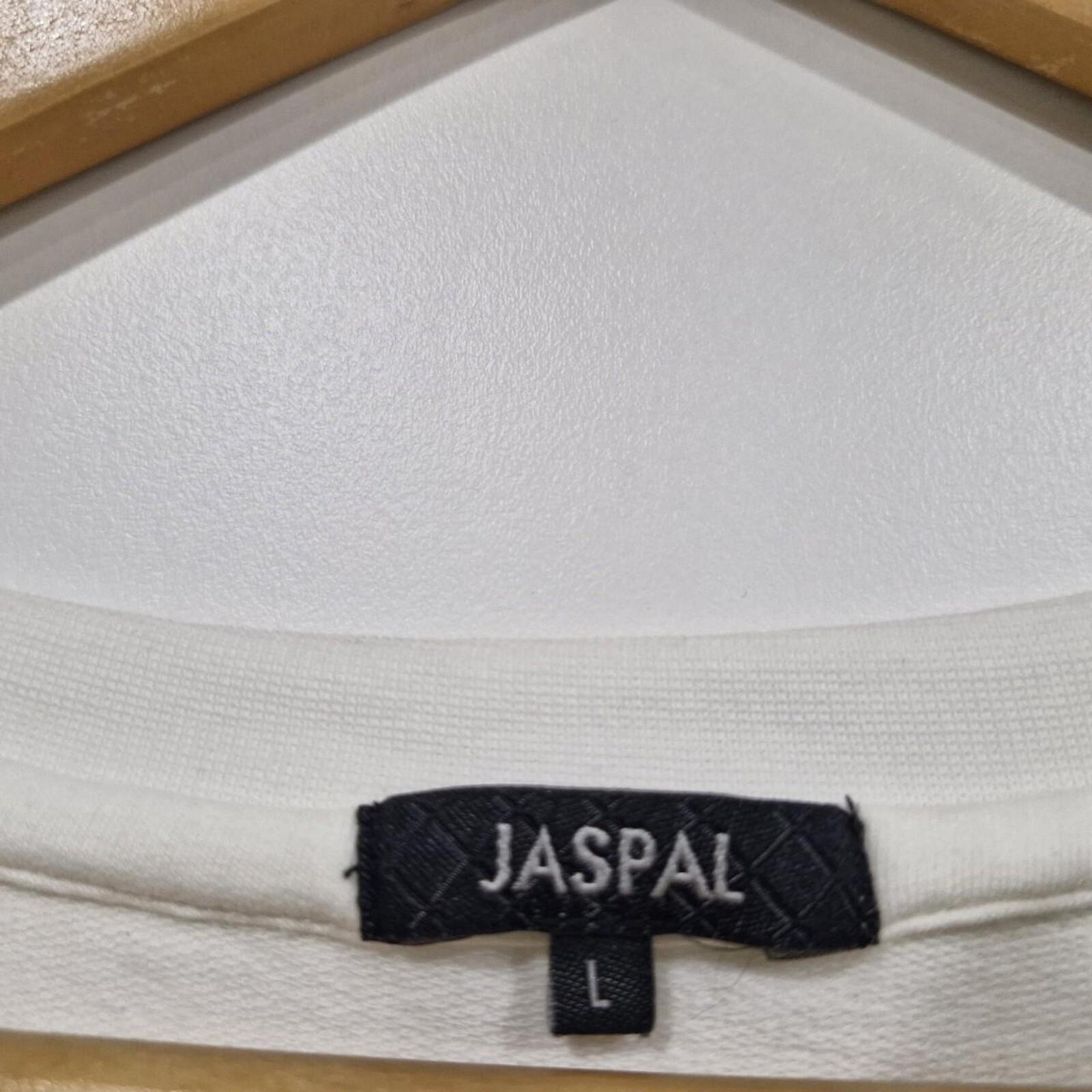Jaspal white cropped top with black lettering and heart detail.