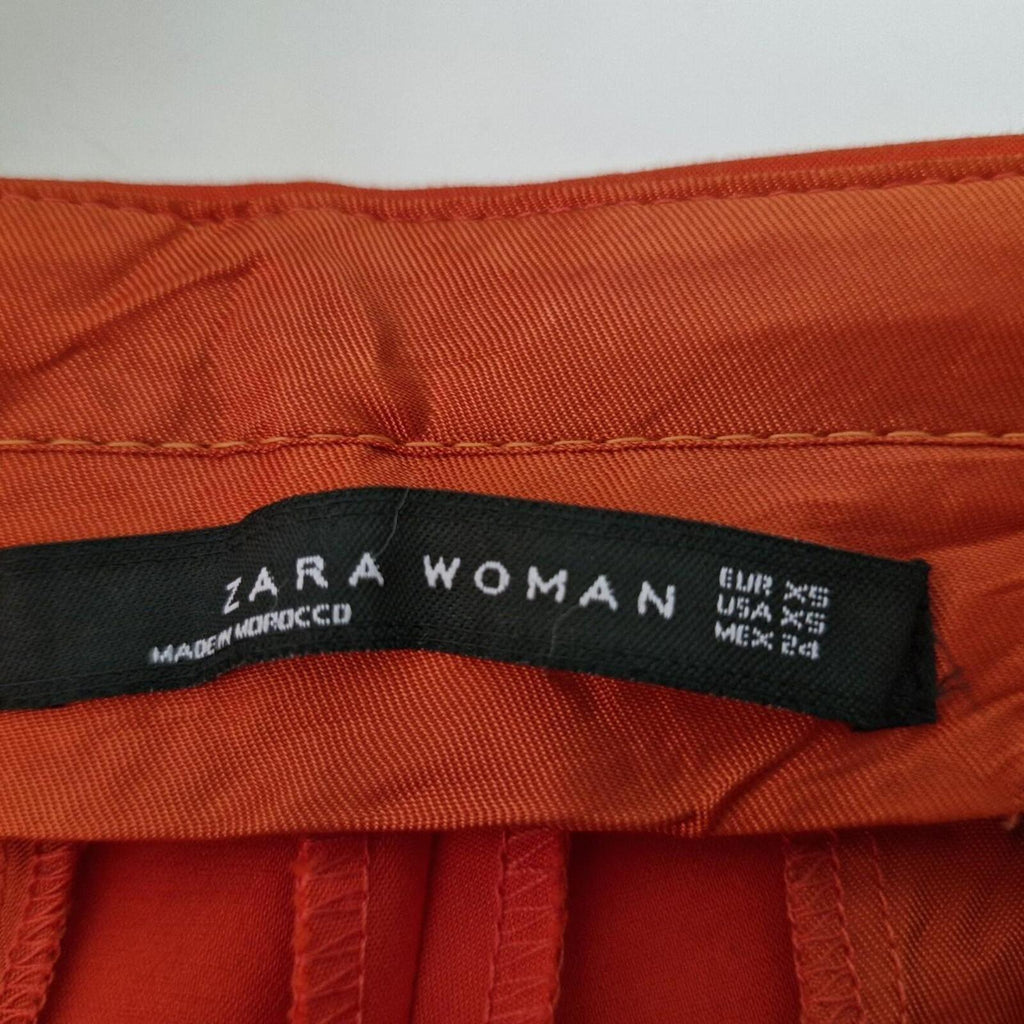 Zara orange high-waisted trousers