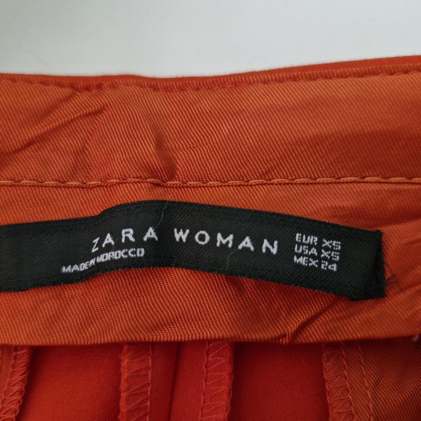 Zara orange high-waisted trousers