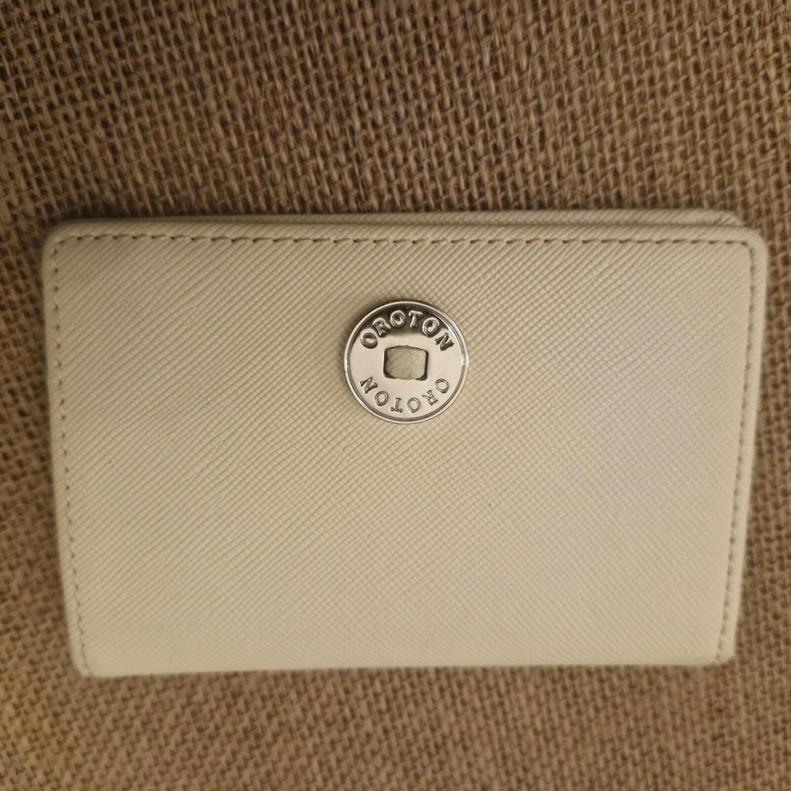 Oroton beige card wallet / purse with silver hardware