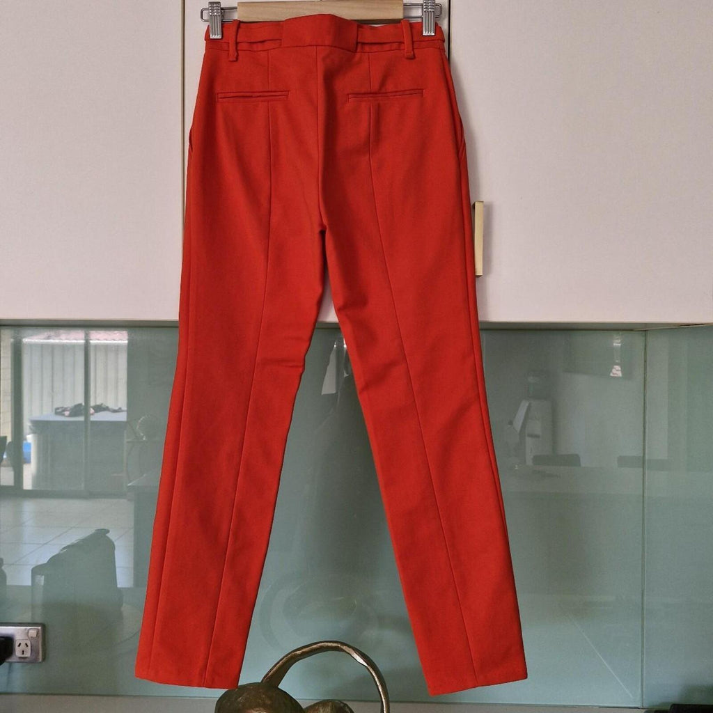 Zara orange high-waisted trousers