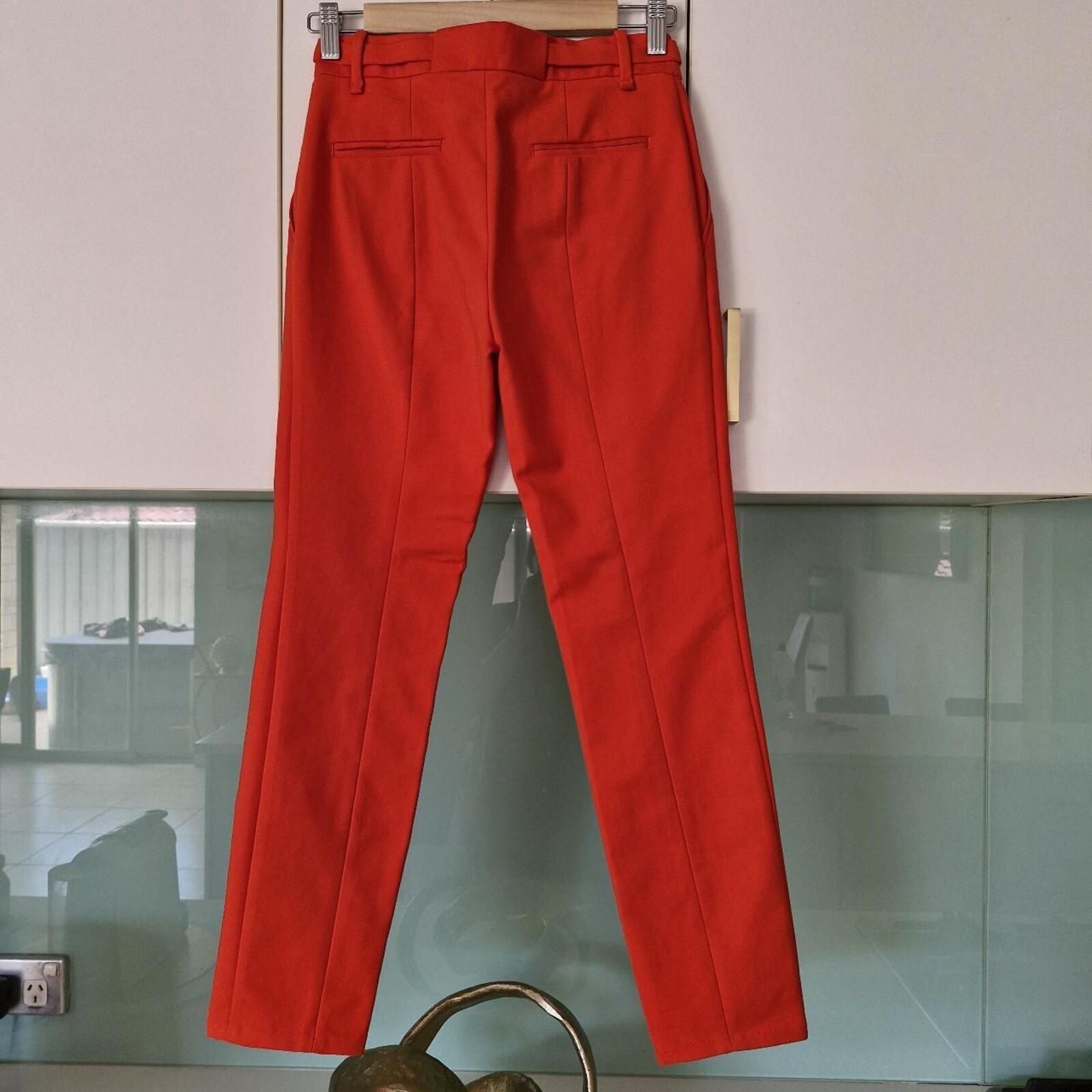 Zara orange high-waisted trousers